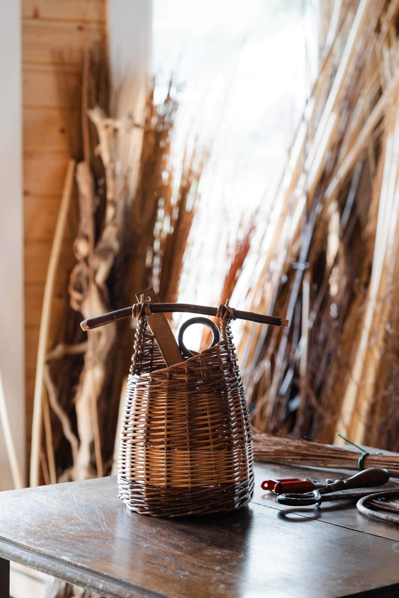willow weaving tools on table - professional photoshoot