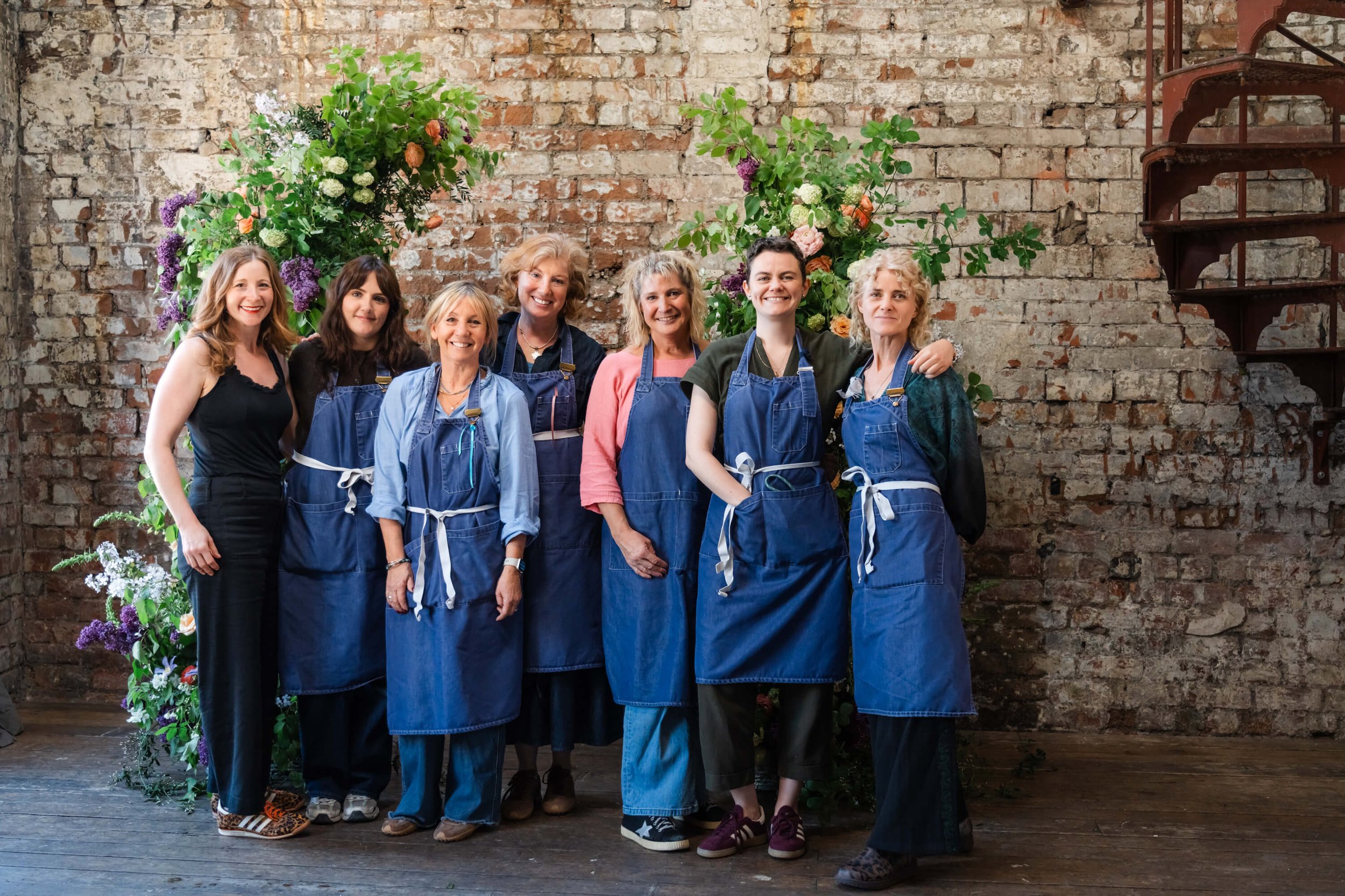 group-of-florists-in-front-of-flower-arch.jpg
