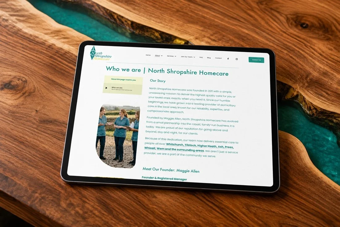 Tablet displaying the North Shropshire Homecare website on a wooden table.