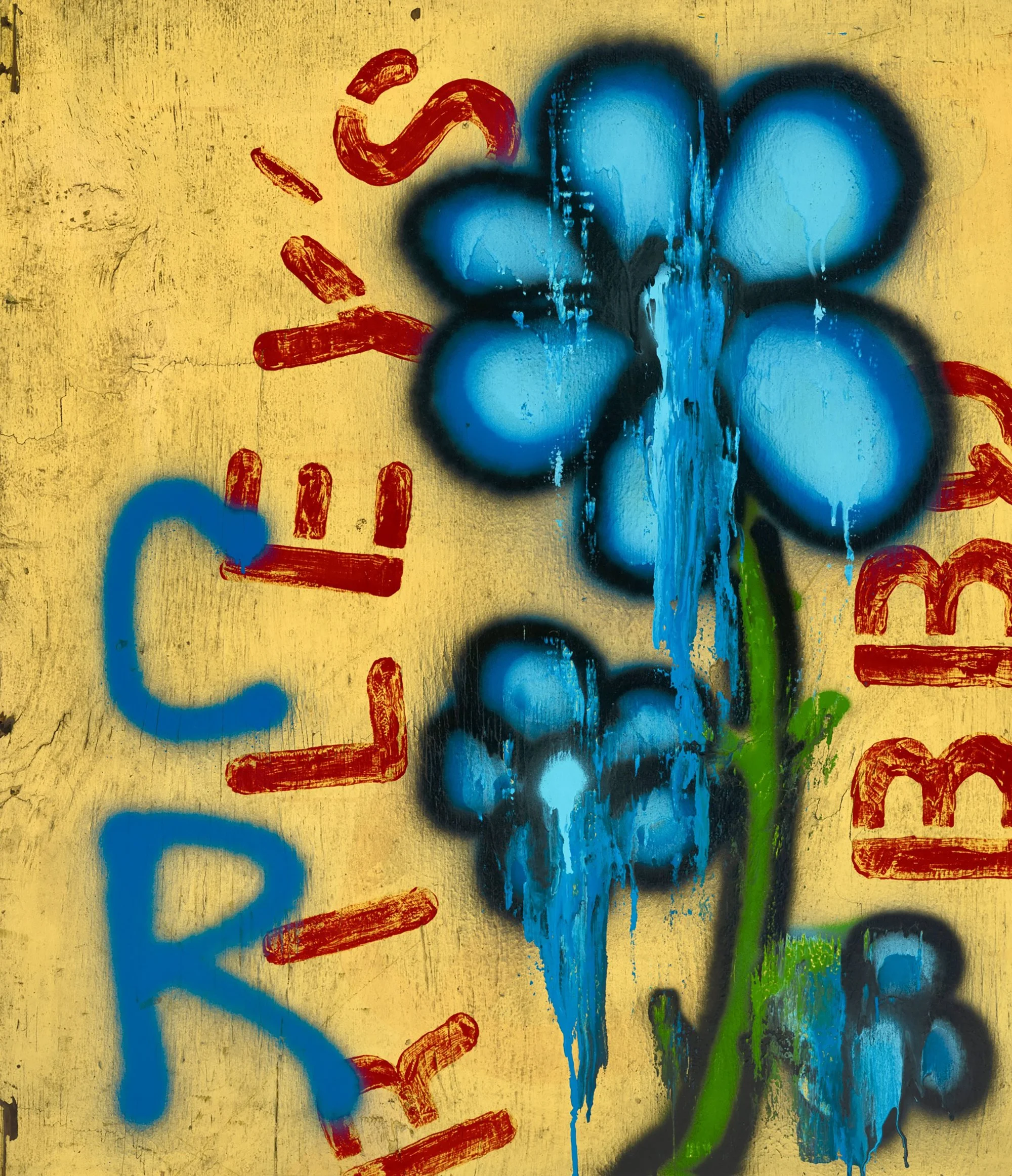 Close-up of graffiti art on a yellow wall featuring a blue flower with black outline, red paint strokes, and green paint at the bottom.
