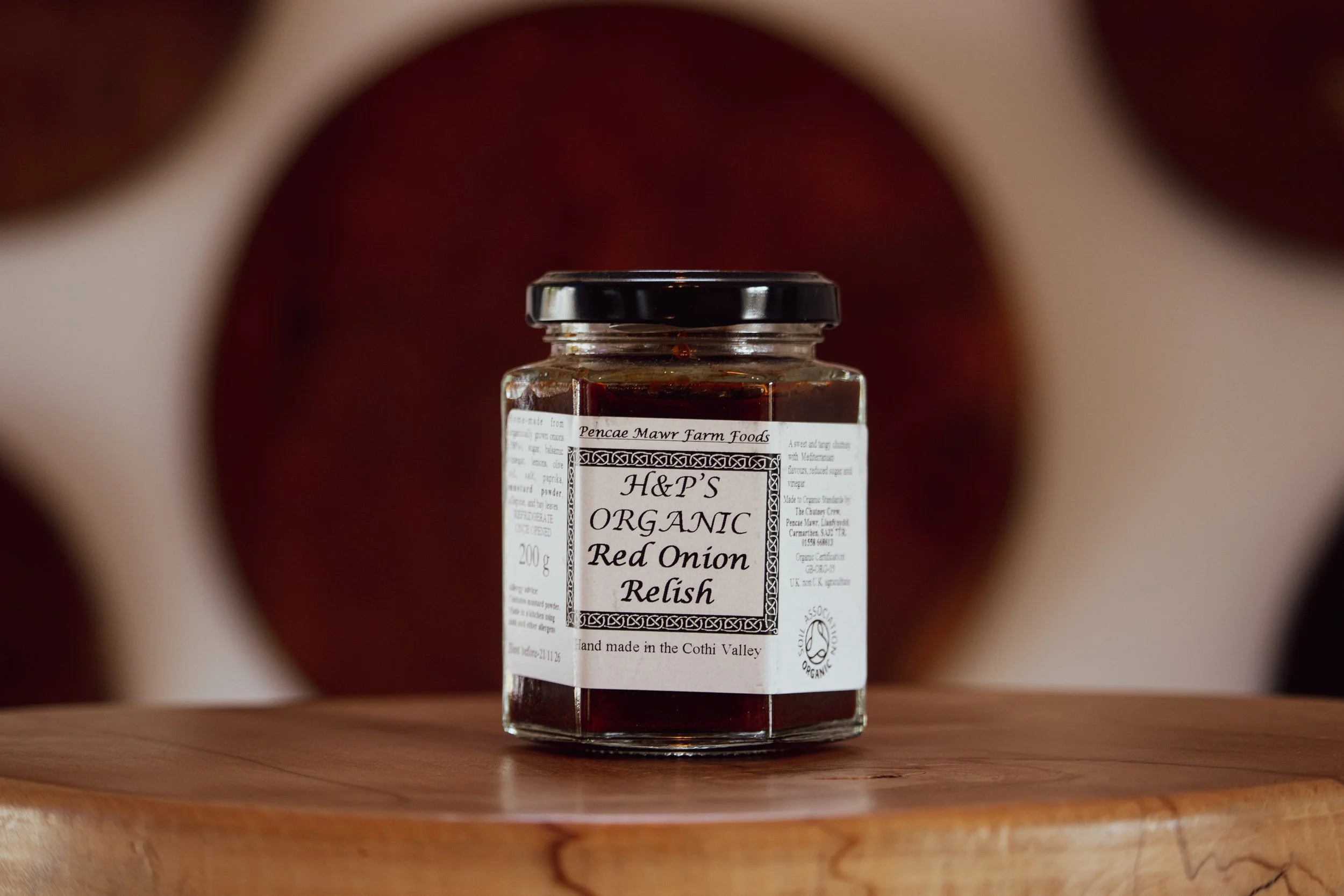 Red Onion Relish on wooden table in farm shop