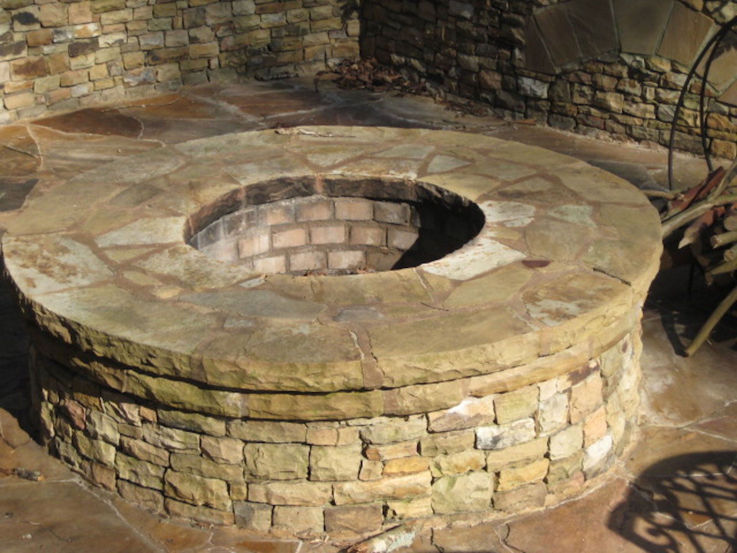 stacked stone firepit with flagstone patio.jpg