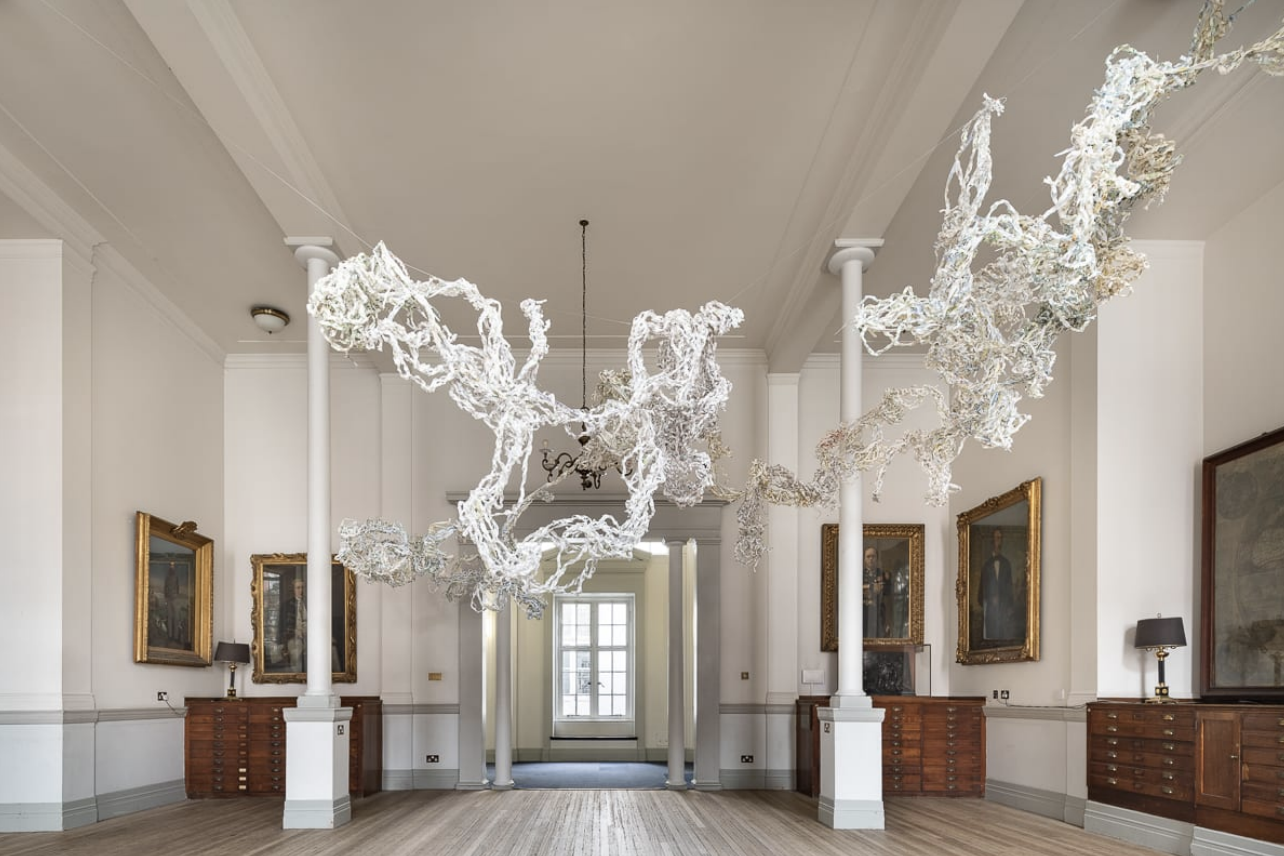 sonia e barrett / Dreading the Map, created as a map-lective / The Royal Geographical Society London. March 2021 / 2021 Antique dated and contemporary maps paper, string metal / 400 x 500 x 500 cm