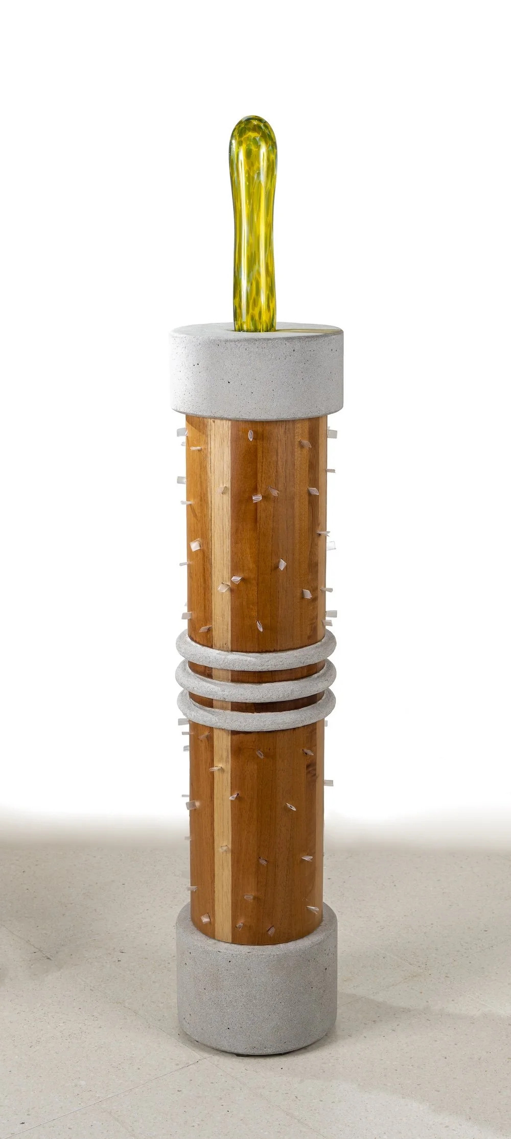   Paved Paradise II  /  Serie: Tropicaribastral , 2025 / Cedar Wood, cast cement, blown glass, 22 cm diameter x 115 cm /  Photo:  Mariano Hernández 