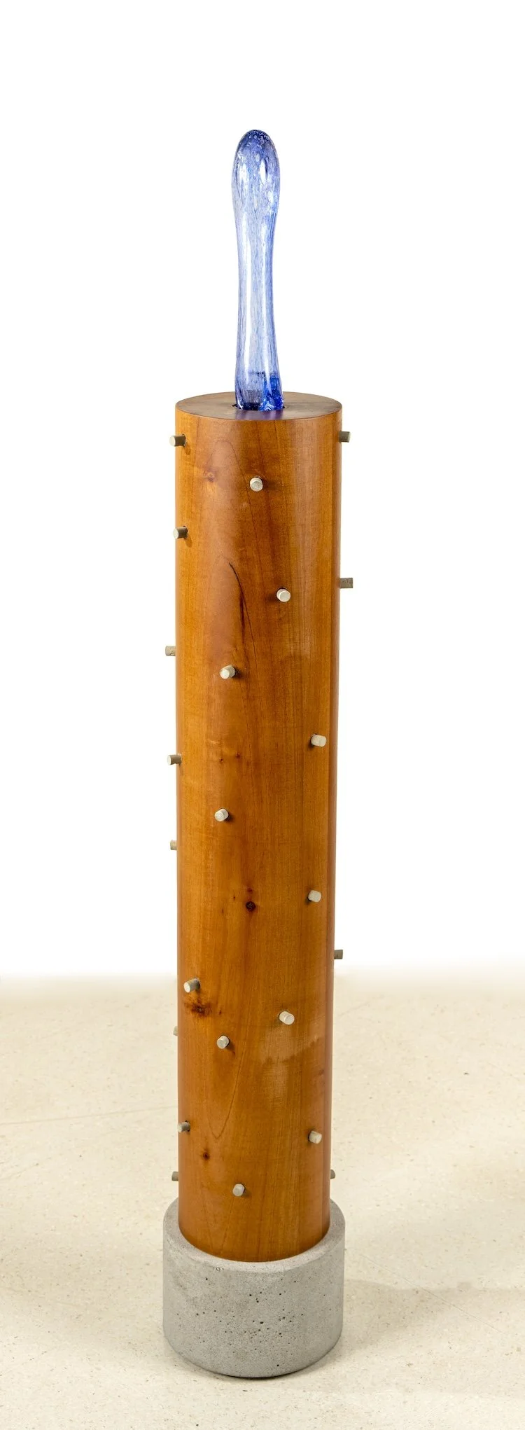   Paved Paradise III (detail) /  Serie: Tropicaribastral , 2025 / Cedar Wood, cast cement, blown glass, 22 cm diameter x 115 cm / Photo: Mariano Hernández 