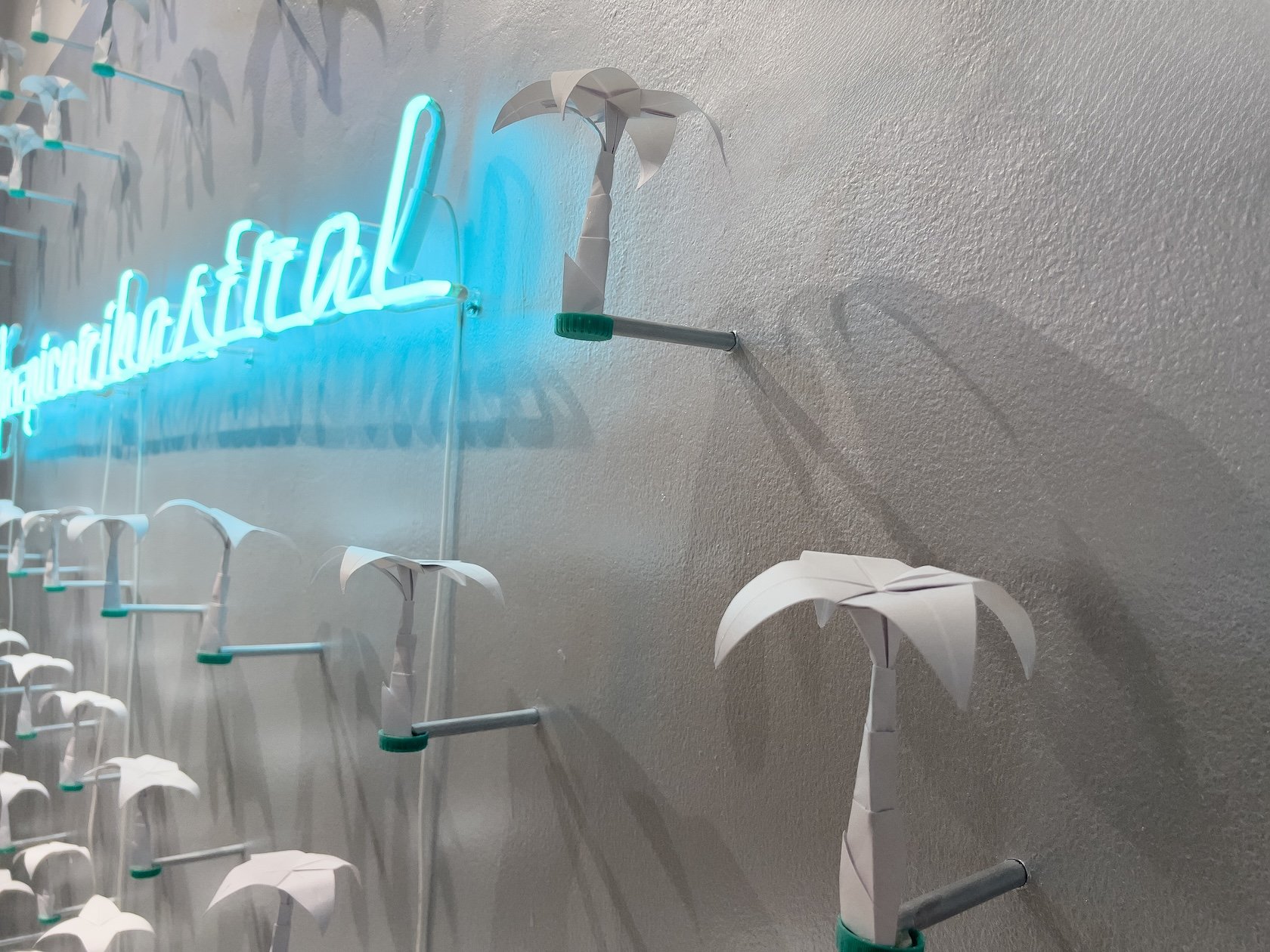   Tropicaribastral  (detail), 2025 / Neon, paper, plastic caps, wood, and pearl paint, 450 cm x 500 cm / Photo: Mariano Hernández 