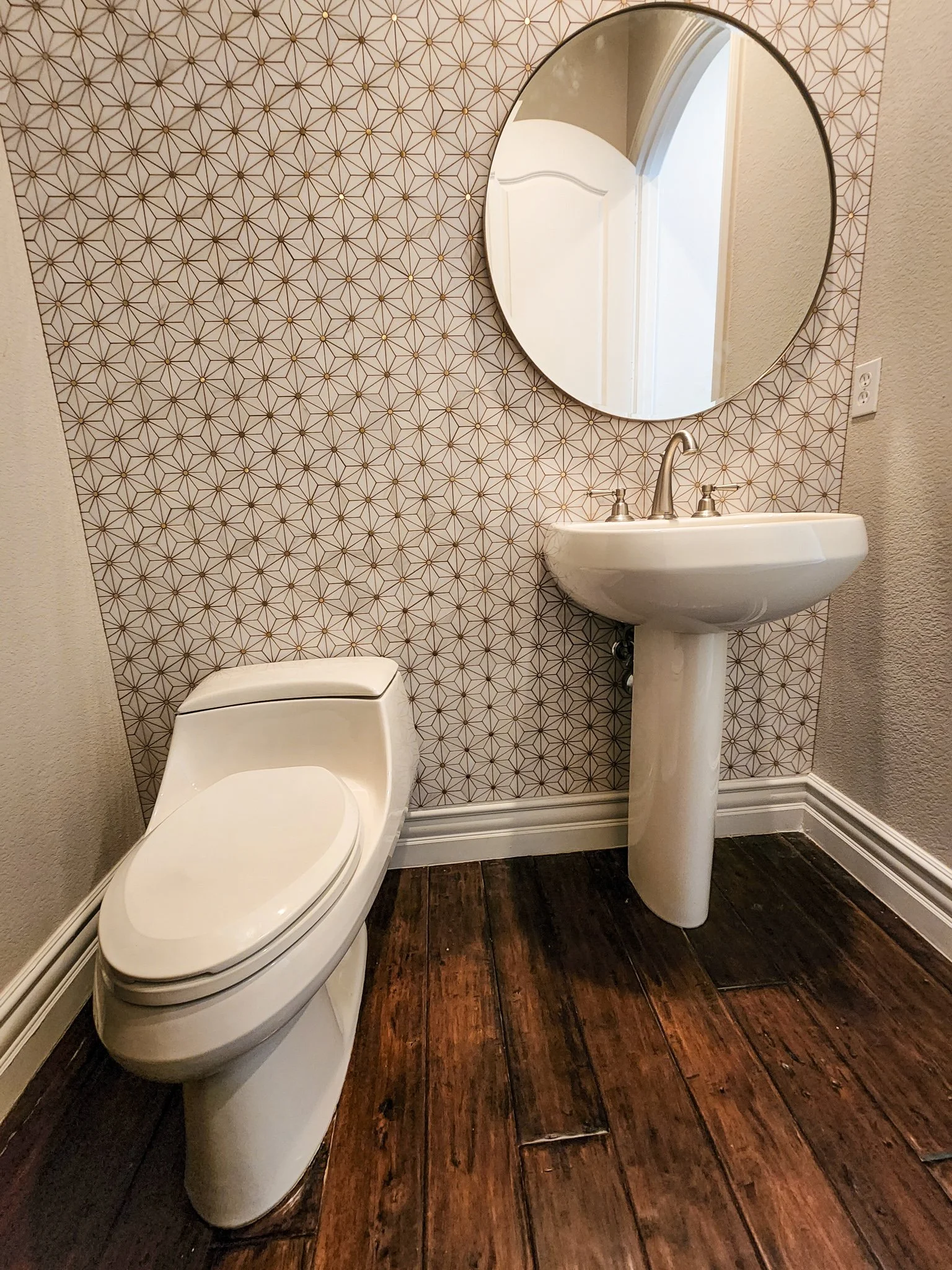 We installed mosaic tile in the powder bath with golden grout.