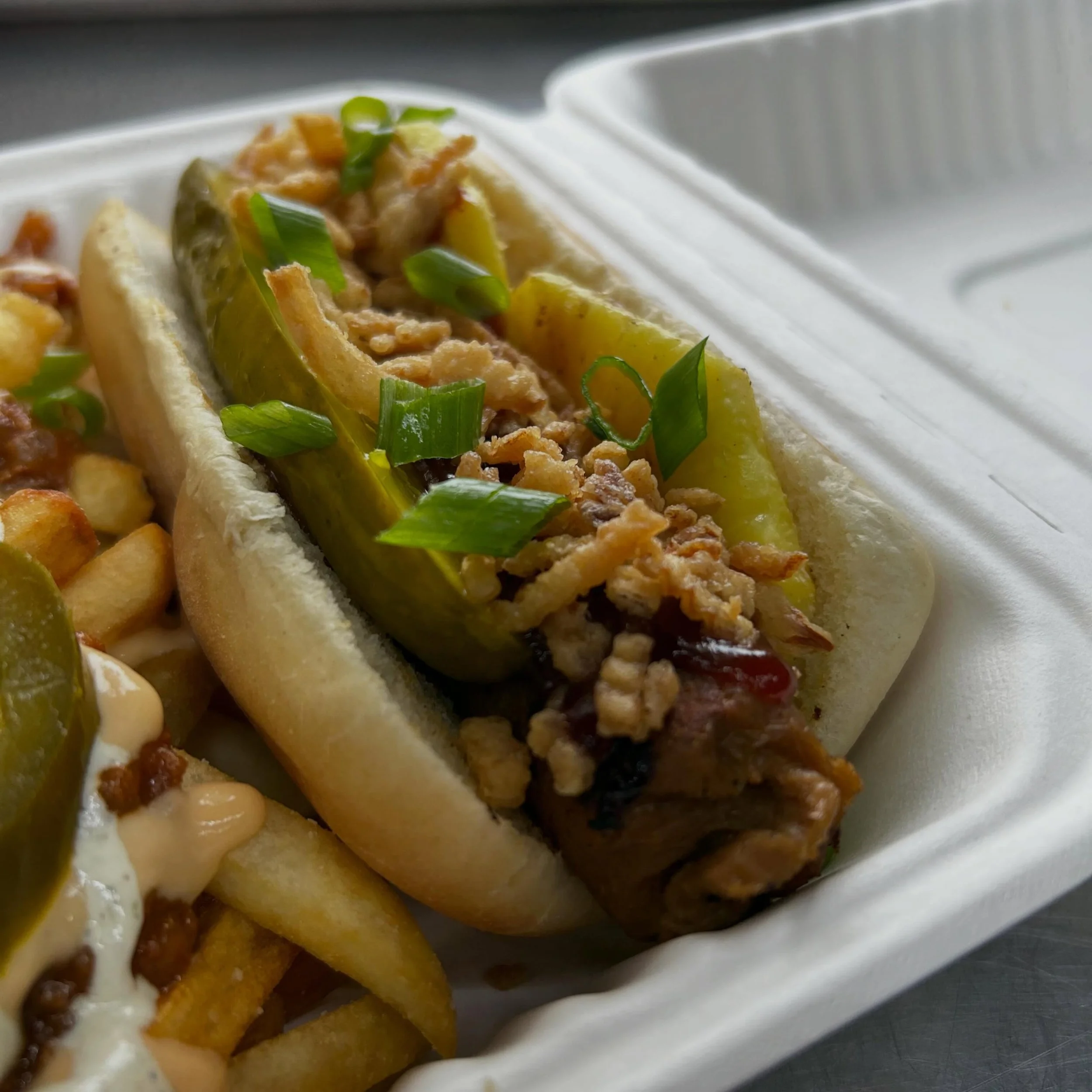 Flyin&rsquo; Hawaii dog is back on the menu! Find us today @humaneohio from 11:30-2pm on W Alexis. Dog is topped with bbq sauce, grilled fresh pineapple, pickle spear &amp; crispy onions and tastes like sunshine! See y&rsquo;all soon!  #vegantoledo #