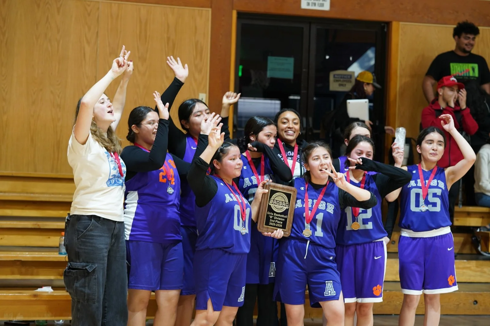 ARISE Girls Basketball team with their runner up plaque