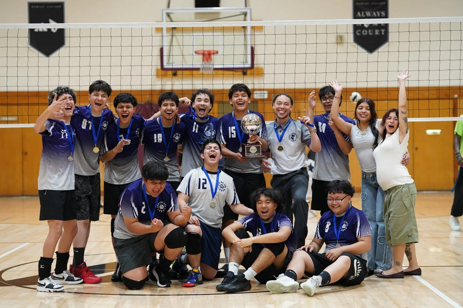 ARISE Boys Volleyball team with their championship trophy