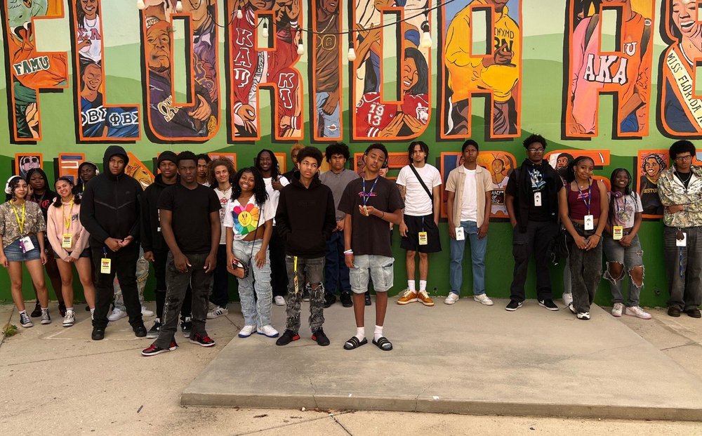 ARISE BSU students in front of a mural at Florida A&M University