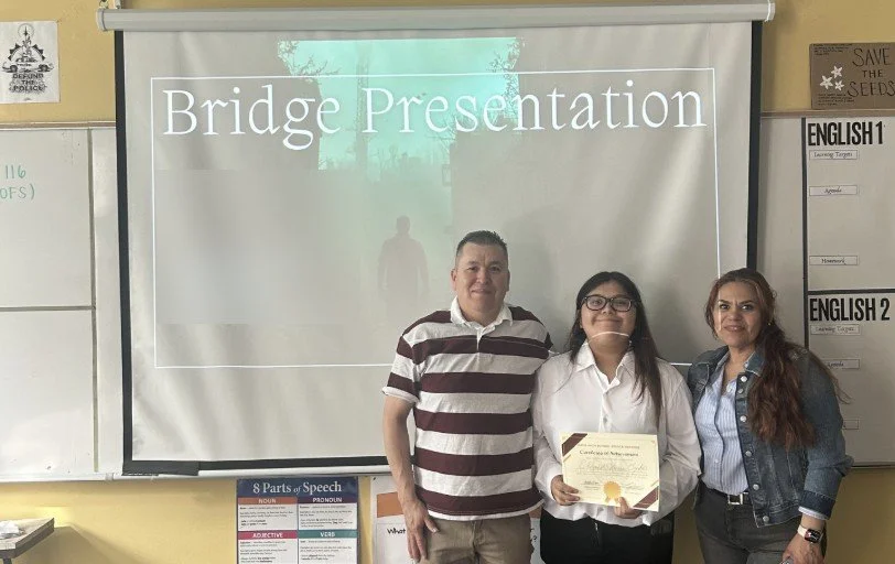 An ARISE student with her advisors after her Bridge Defense