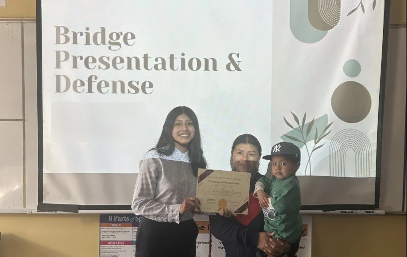 An ARISE student with her family after her Bridge Defense
