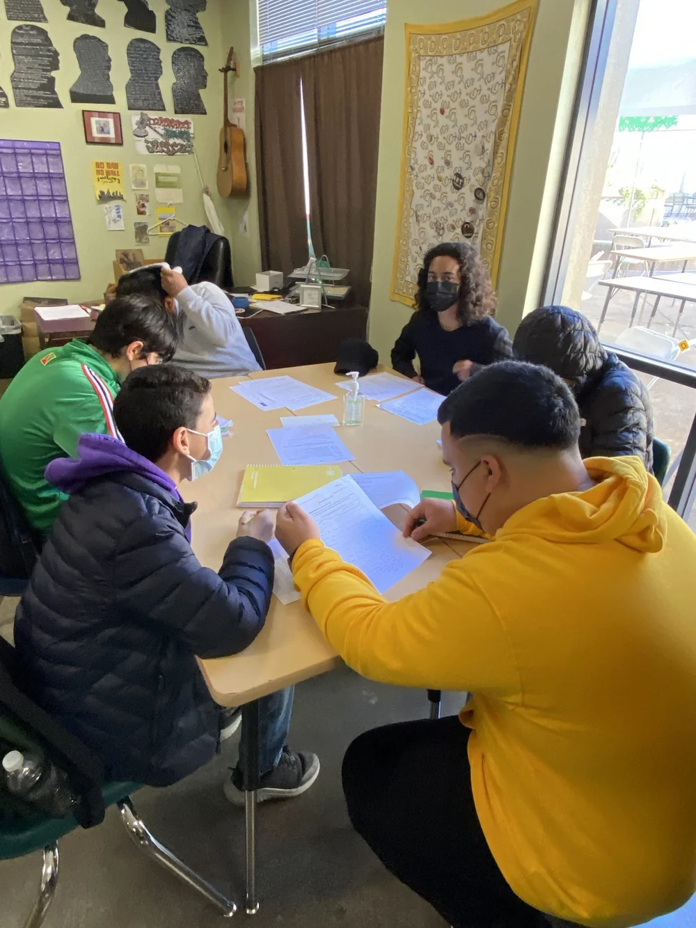 An Academic Mentor working with a small group of ARISE students