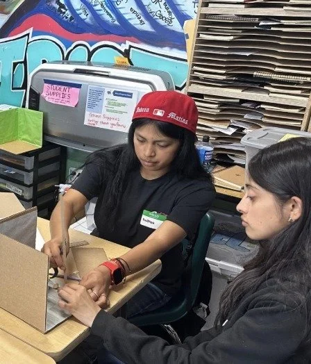 Academic Mentor Juanita Lemus, ARISE Class of 2020, helping students in Art 2 and 3