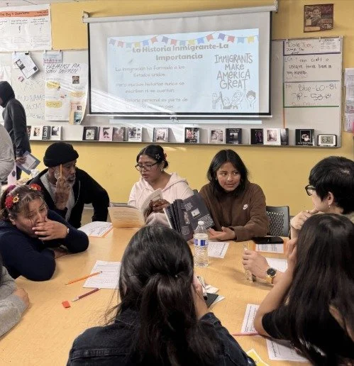 ARISE Humanities students sharing their photo books with families