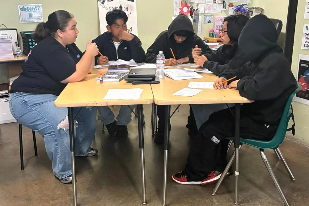 Academic Mentor Brenda Aguilar leading a small group discussion with ARISE students