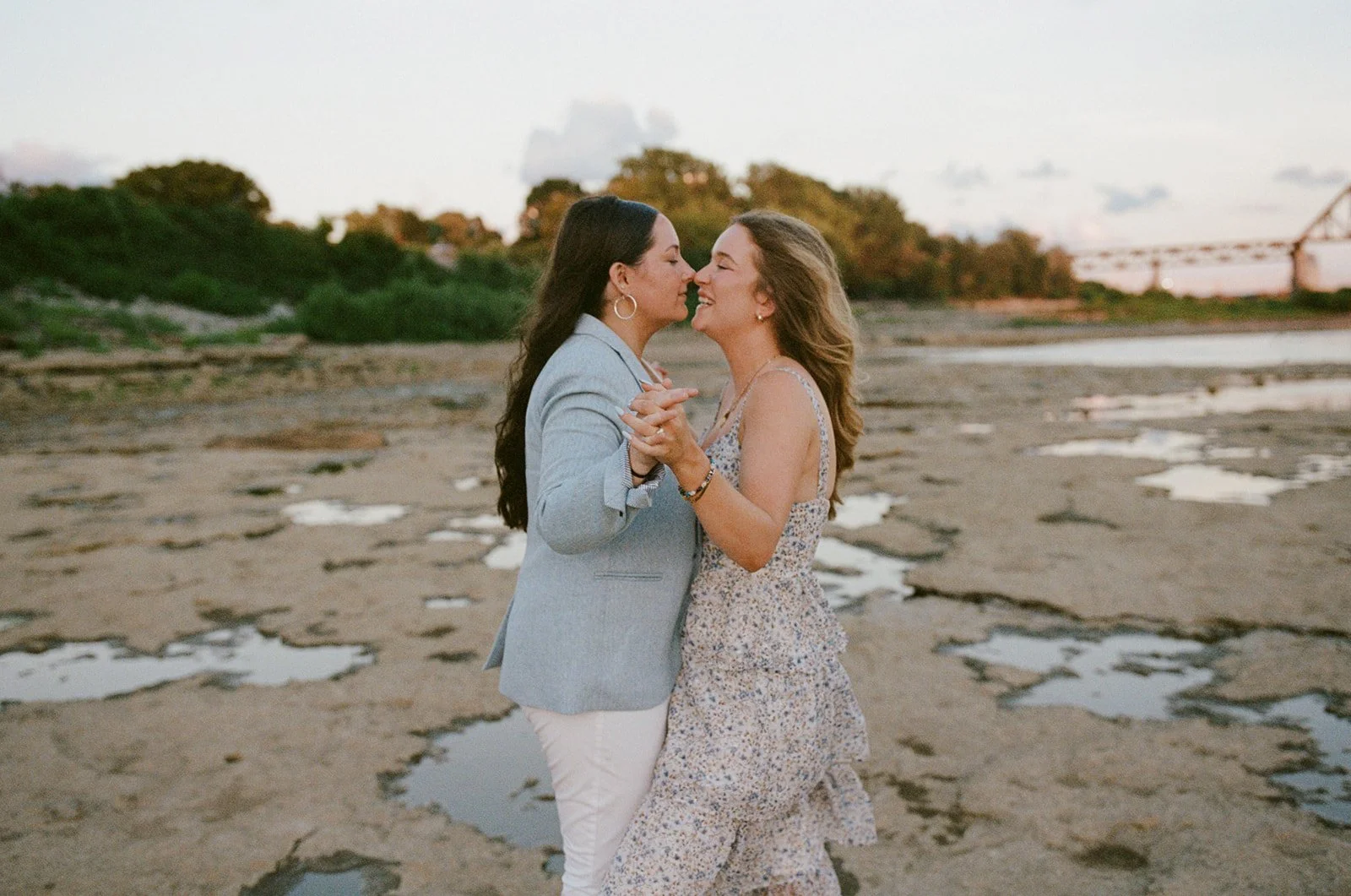 Couple holding stands and staring at each other on a beach