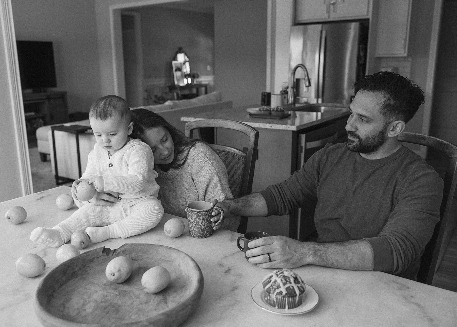 Family cozied up at their kitchen table in their home