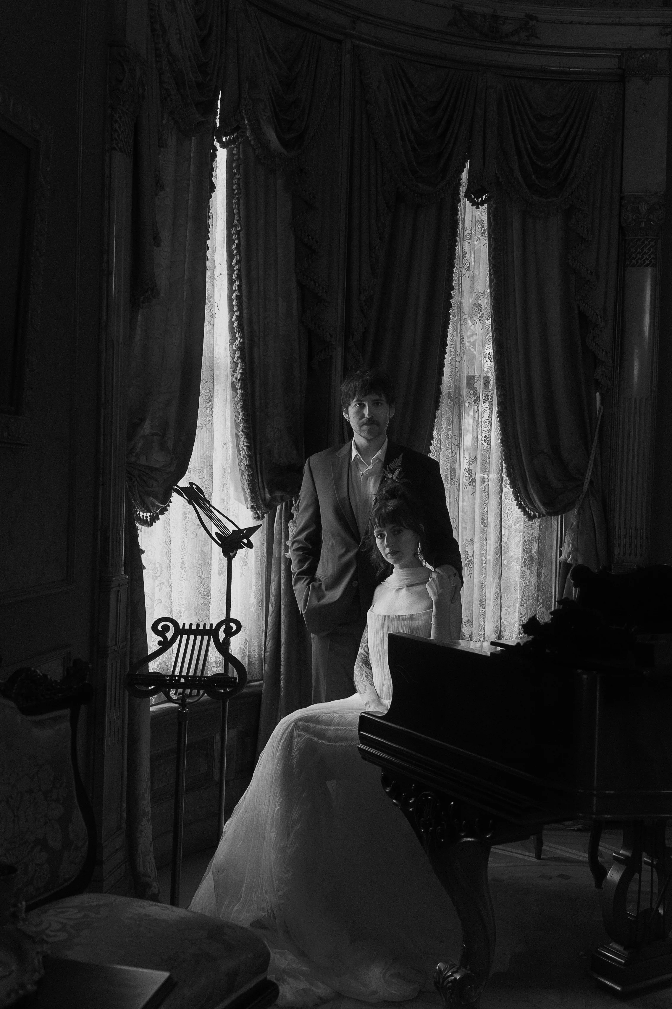 Black and white moody shot of a husband and wife on their wedding day