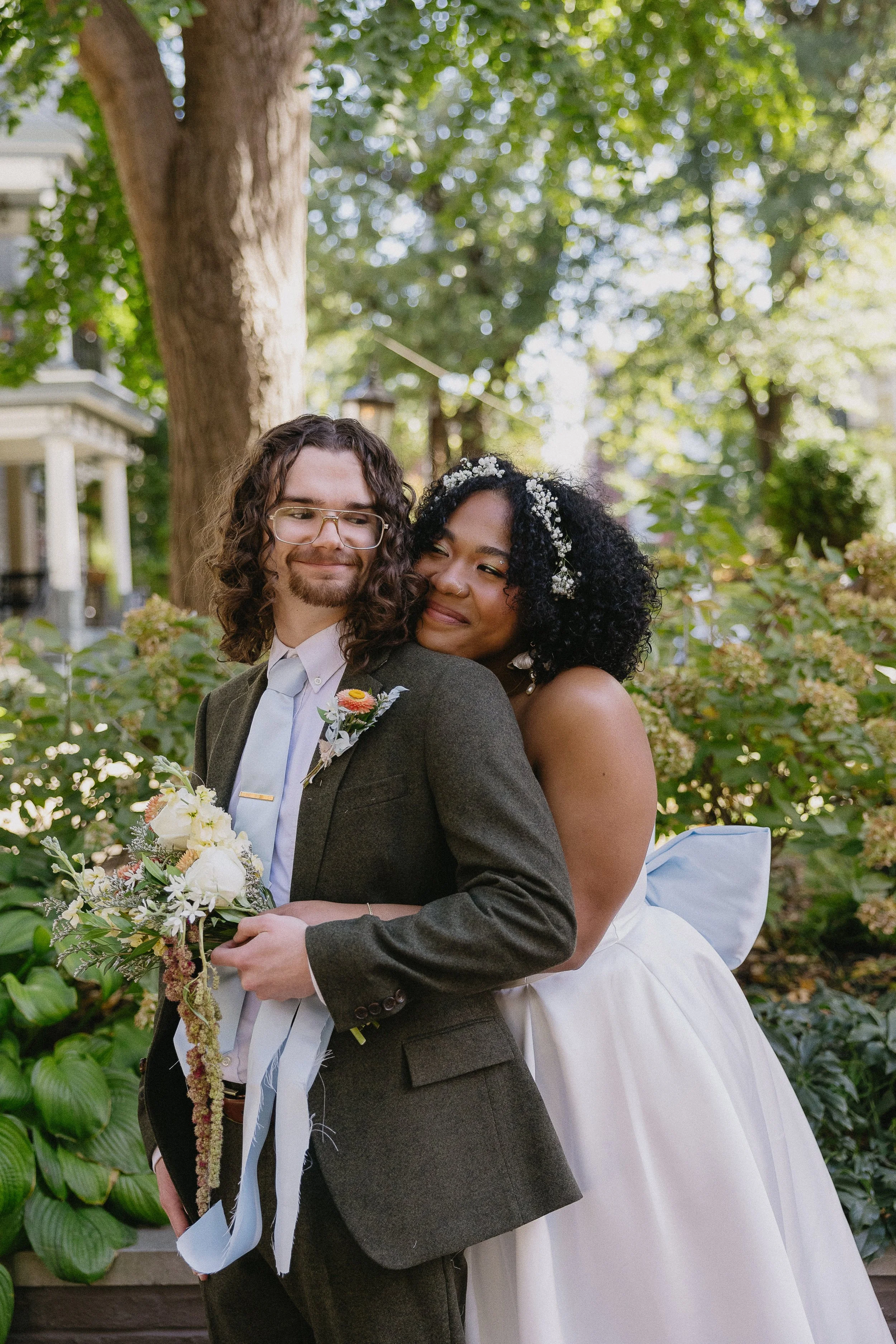 Happy couple cozied up on their wedding day