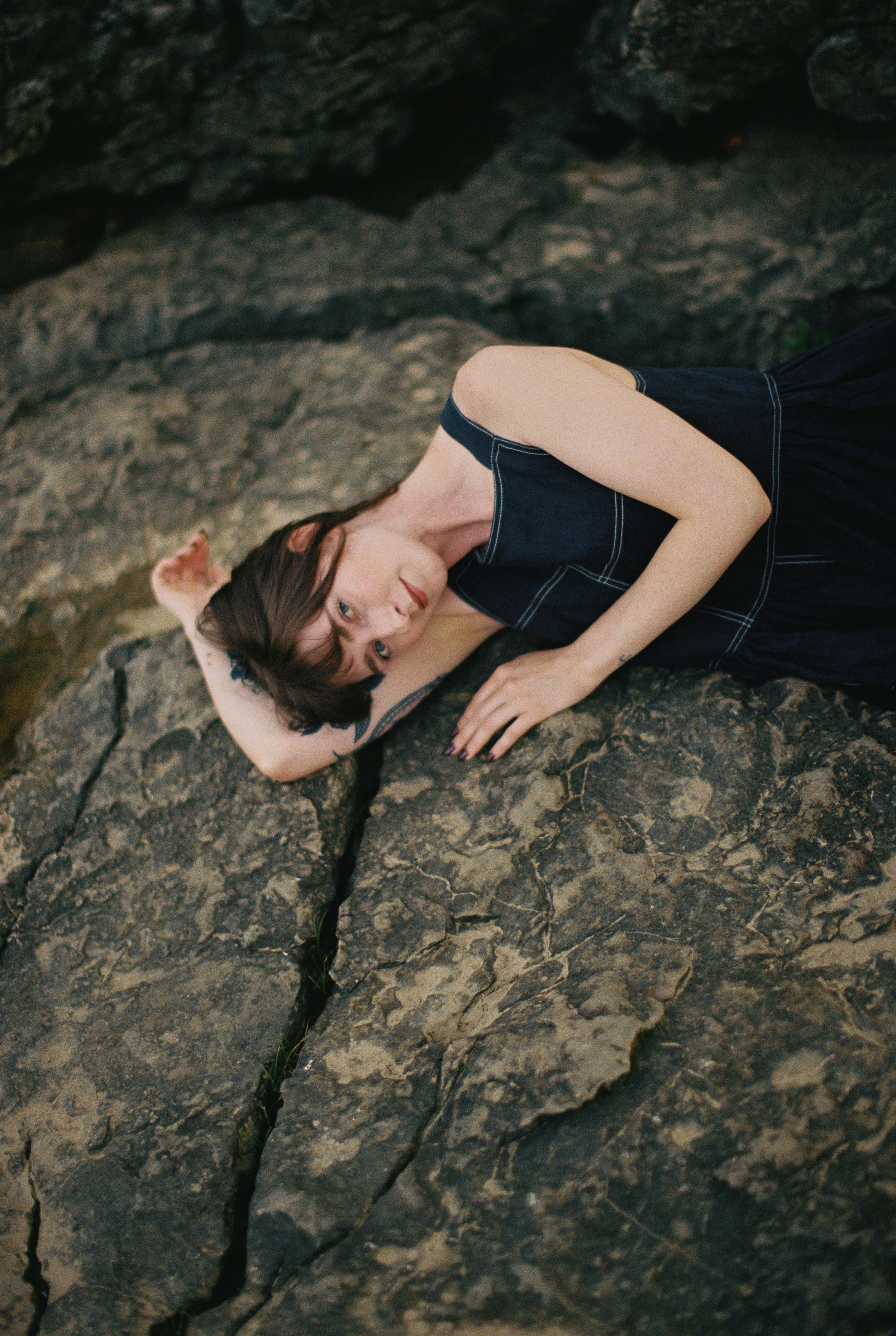 Portrait shot in nature, posing on a rock