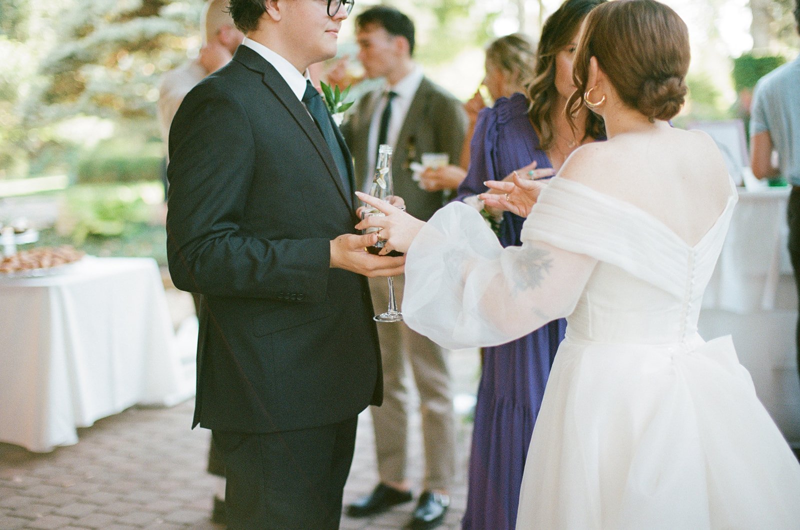 Bride talking to guests at her wedding