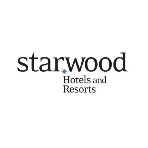 Starwood Hotels and Resorts logo with black text and a blue snowflake, on a white background.