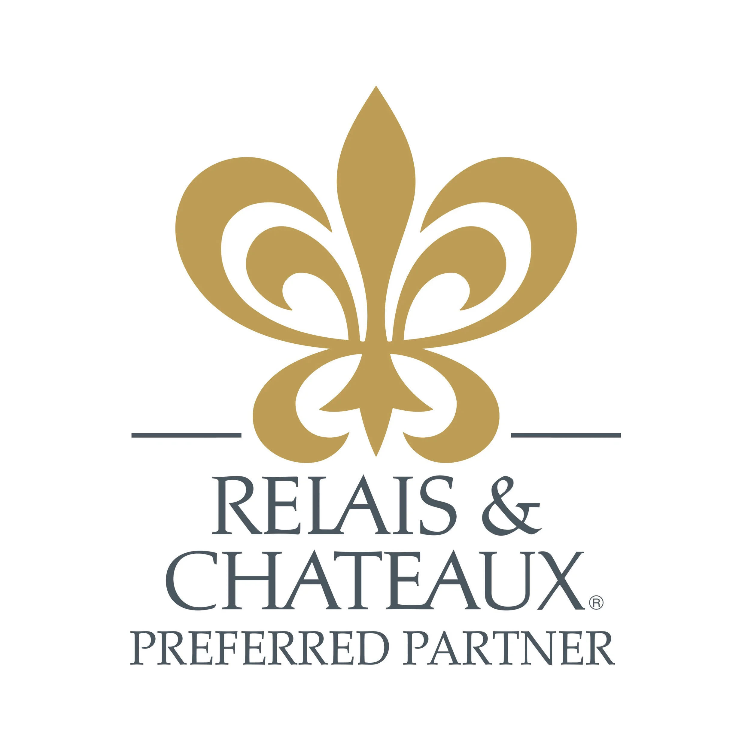 Logo for Relais & Chateaux featuring a gold stylized fleur-de-lis with the words 'RELAIS & CHATEAUX PREFERRED PARTNER' below.