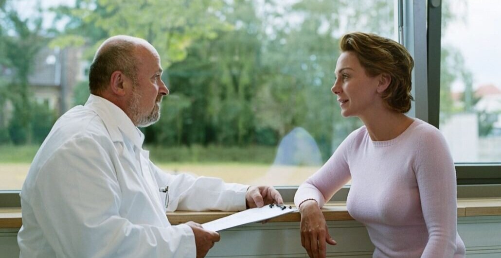 Doctor talking to patients Healios.jpeg