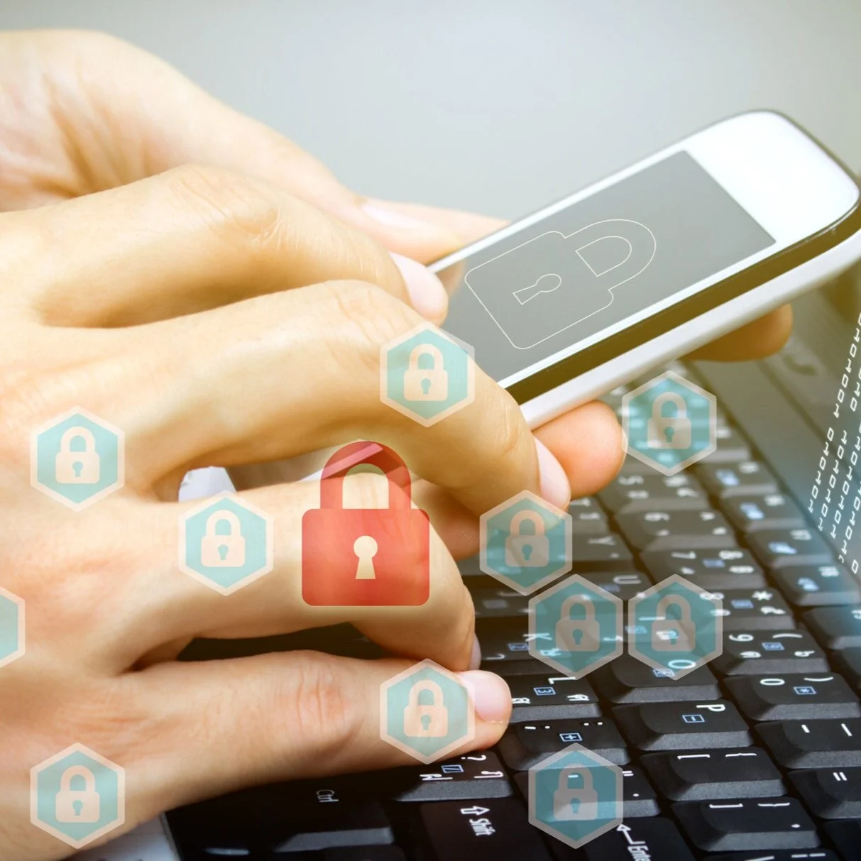 Canva+-+hand+use+smartphone+and+laptop+with+padlock+technology.jpg
