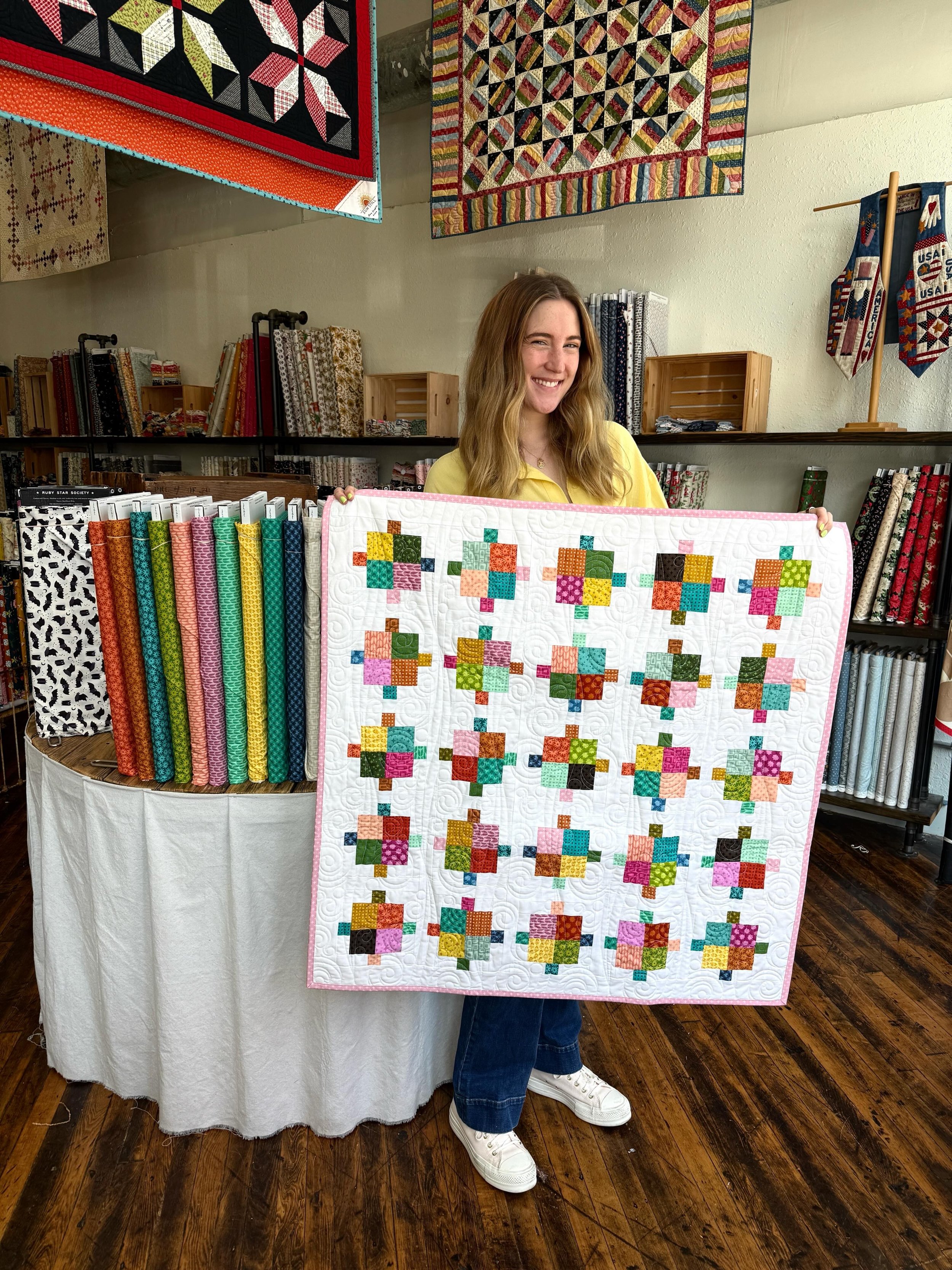 Jillian is holding the Simply Charming, July / Asteroids Quilt -- and it's so fun in @elizabethagh new Scenery fabric! If you buy a charm pack (from any collection) you can get this pattern for free! We have this quilt top as a kit, too!! 

You can a