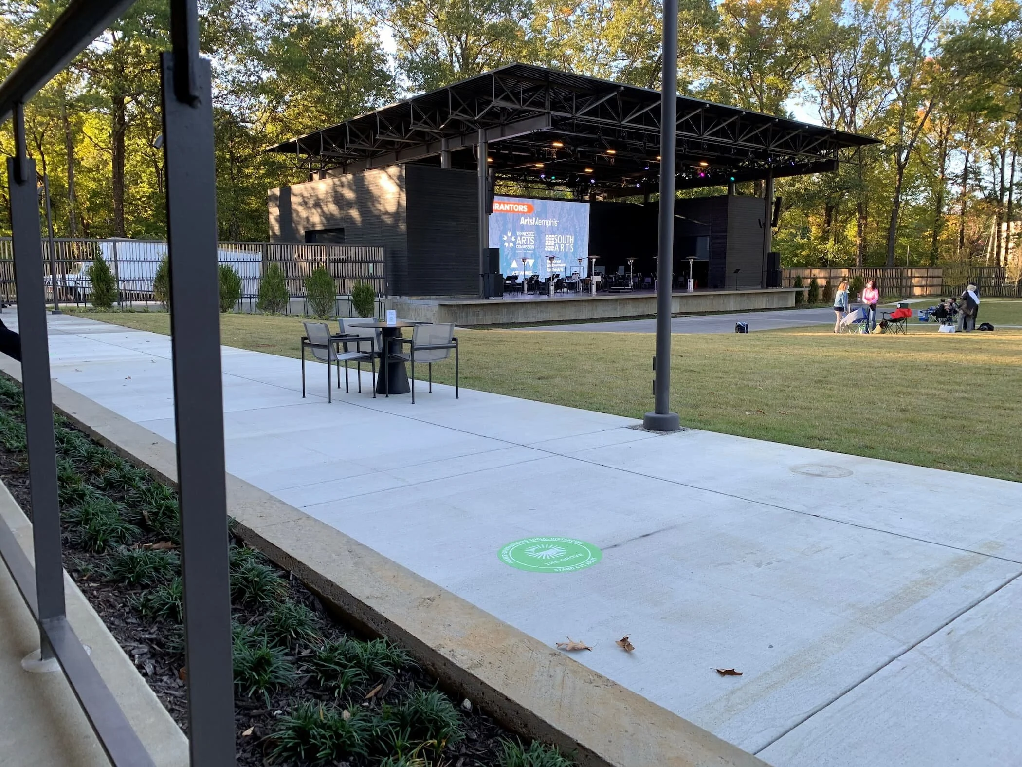 An outdoor entertainment venue with dining chairs and dining tables 
