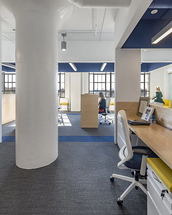 Workstations, mobile storage, and task chairs in an office