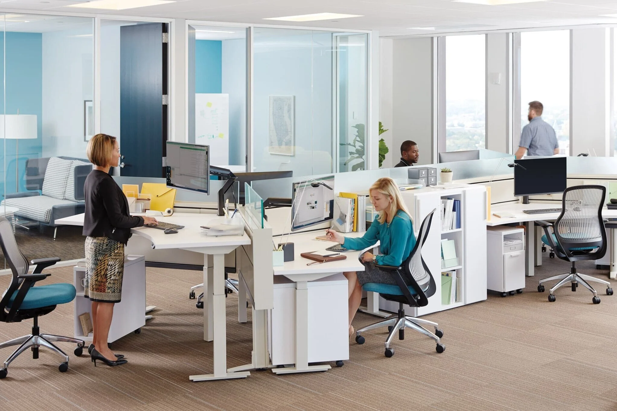 Employees+in+an+open+office+environment+working+independently+at+height-adjustable+desks