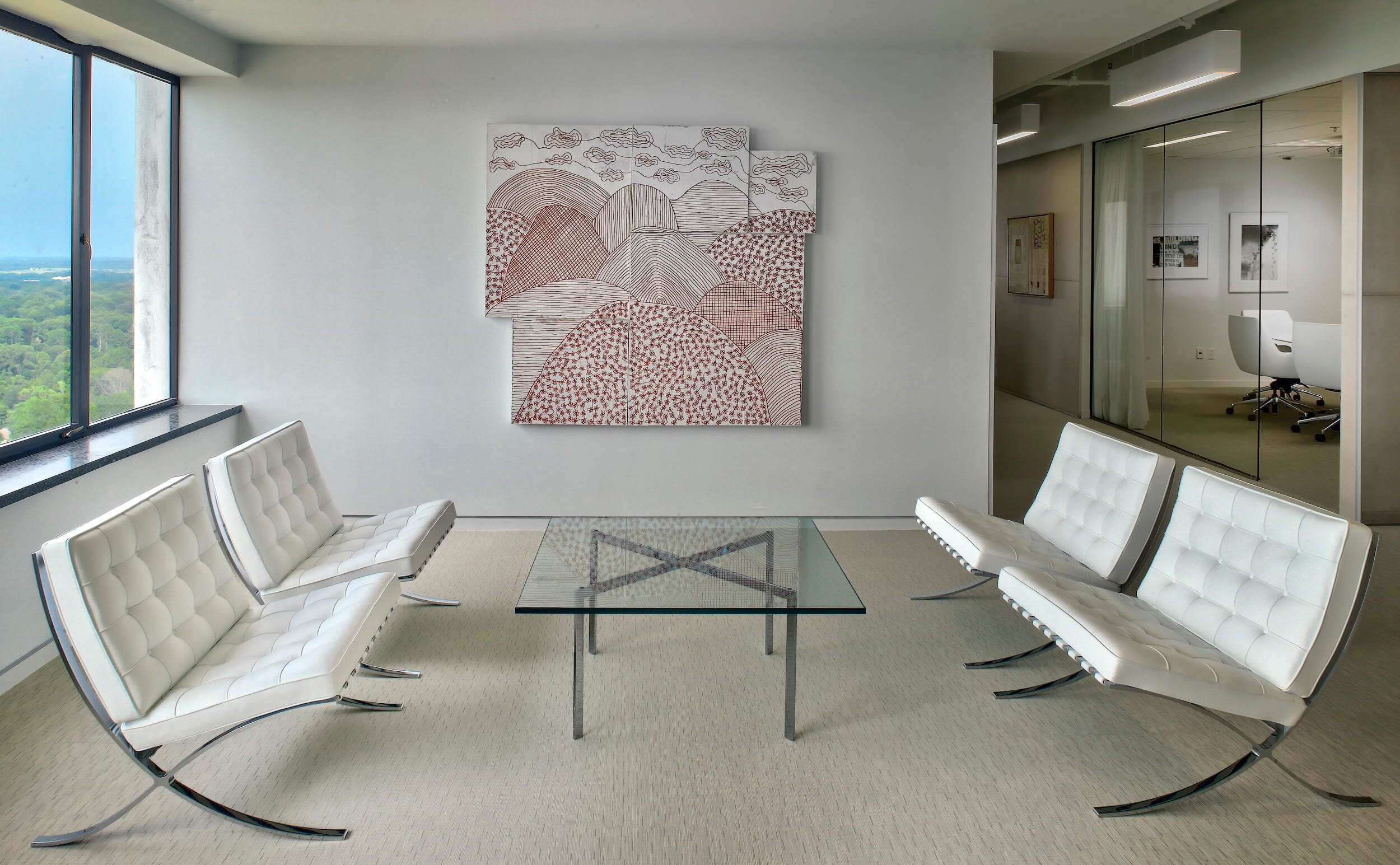 Mercer Capital waiting room with Knoll Barcelona chairs and a Florence Knoll coffee table