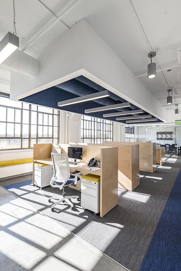 Workstations with mobile storage and task chairs in an office