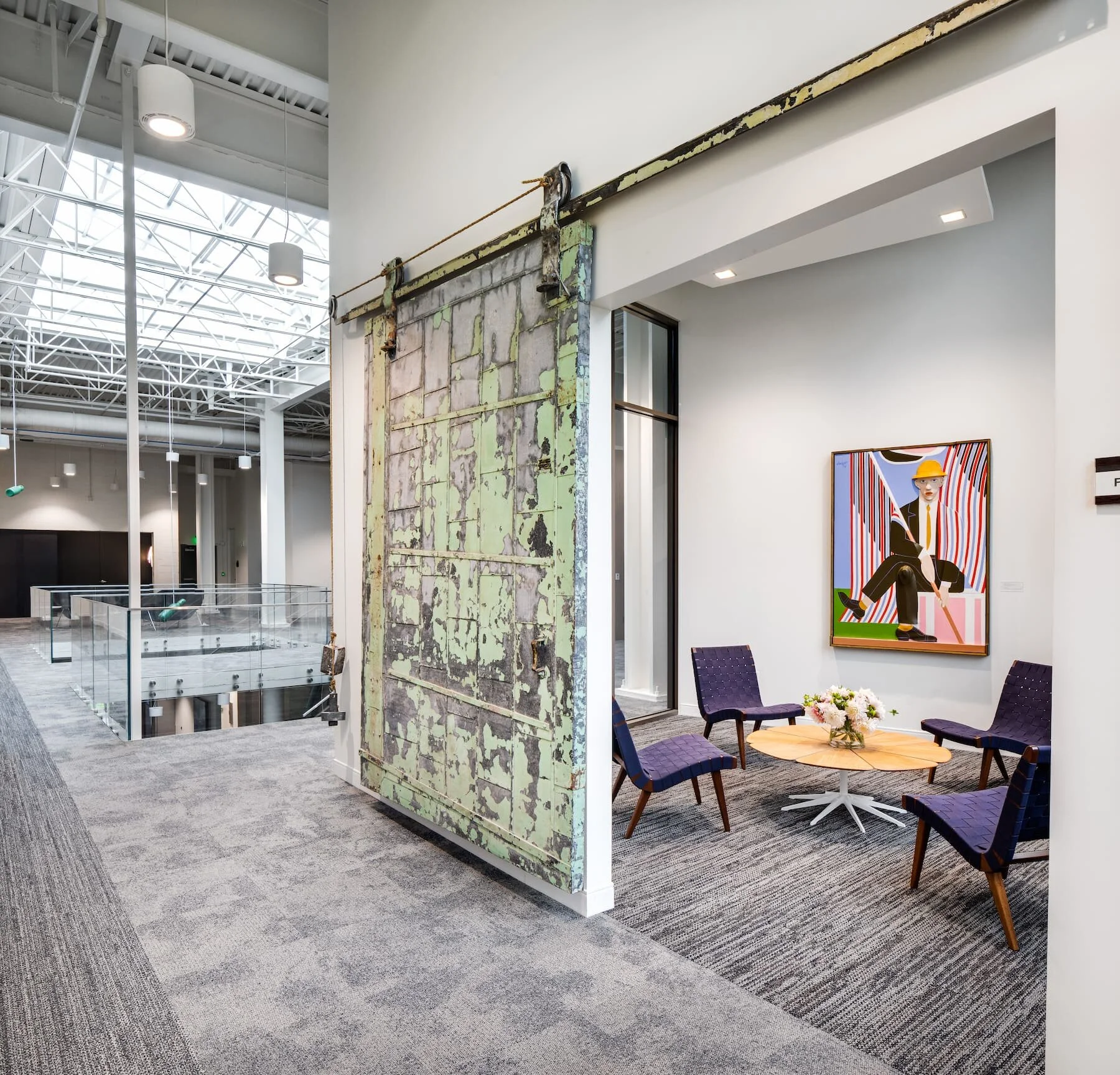 A common area with seating and a coffee table at the nexAir office