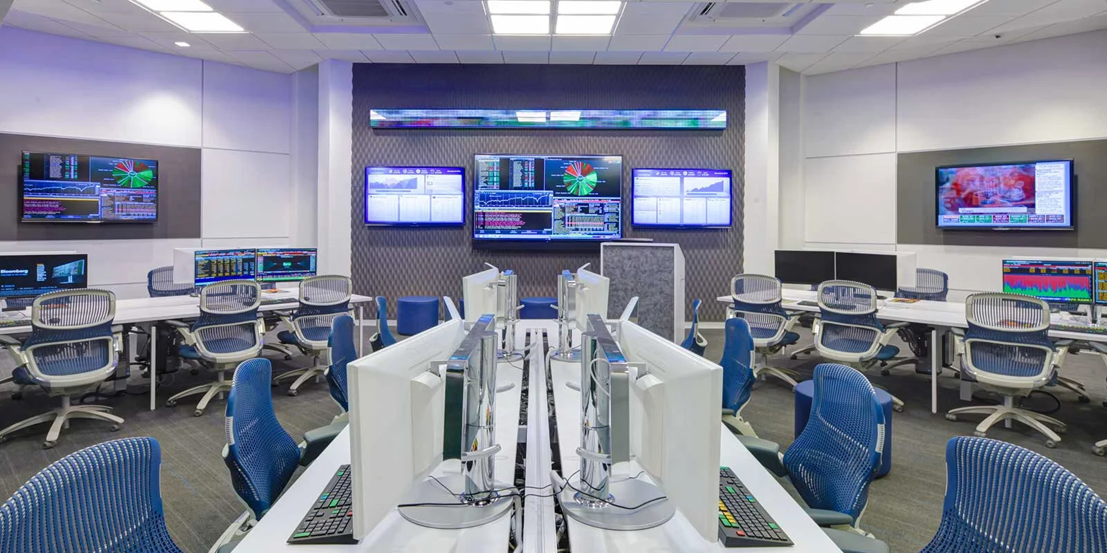 Generation chairs and computers on long tables in an education lab at the University of Memphis