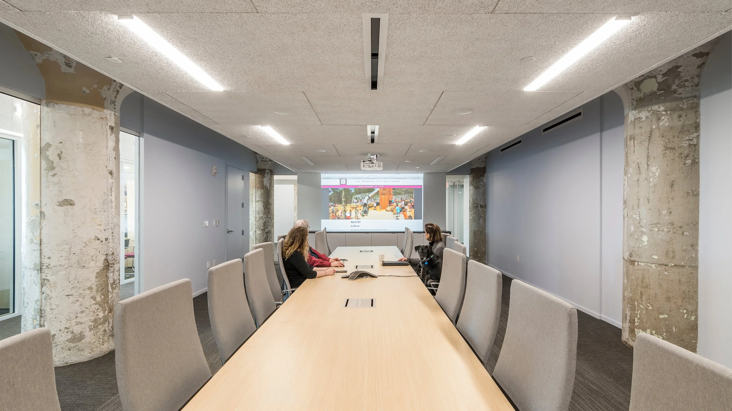 A conference room with a conference table and conference chairs
