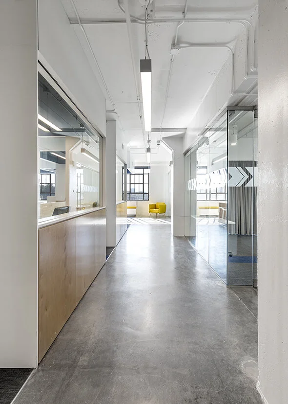 Bench seating and an armchair in an office