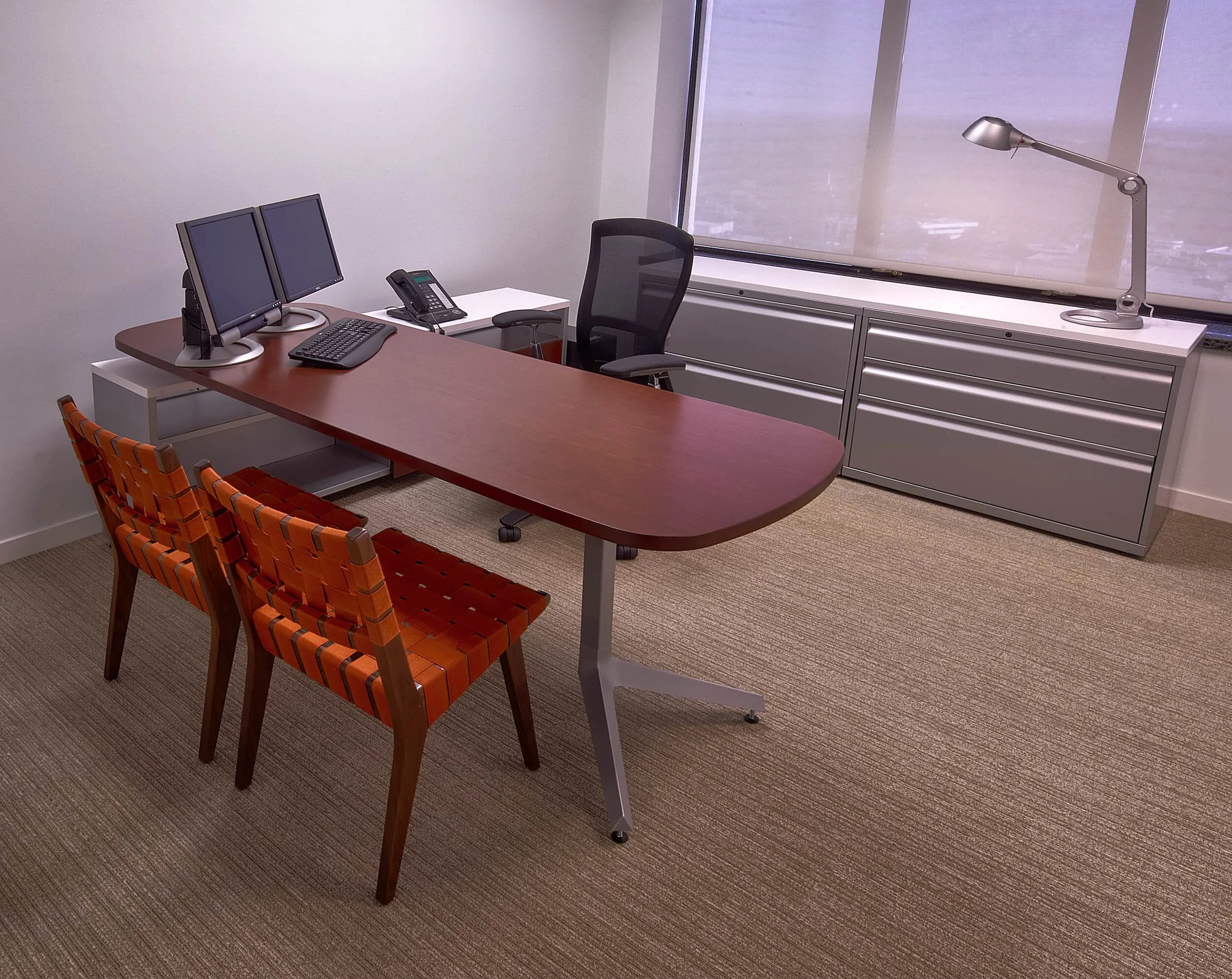 A private office at Mercer capital with a Dividends Horizon desk, Life task chair, and Risom side chairs