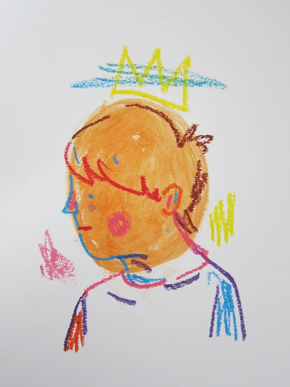 Childlike crayon drawing of a boy in profile wearing a simple yellow crown, rendered in loose colorful lines on a white background.