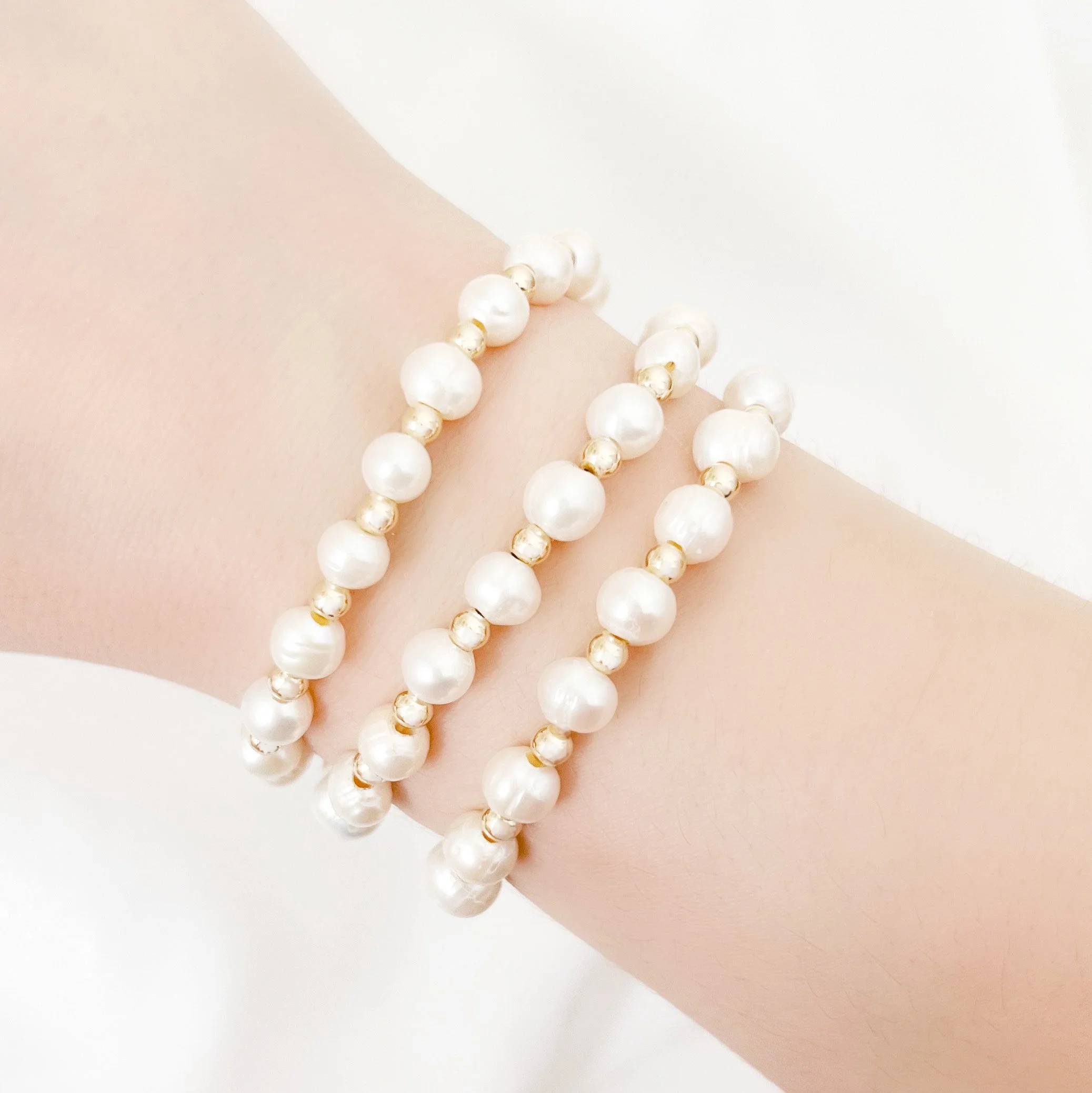 golden pearl bracelets on.JPG