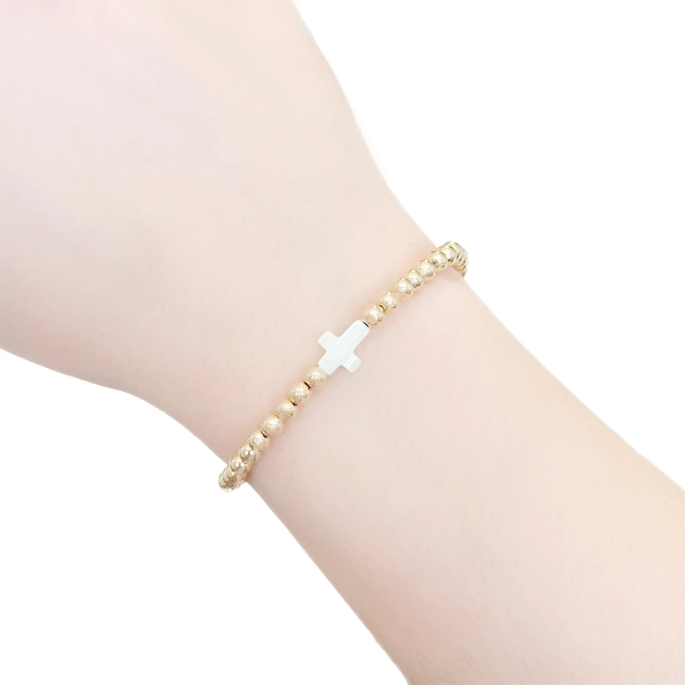 pearl cross bracelet on.JPG
