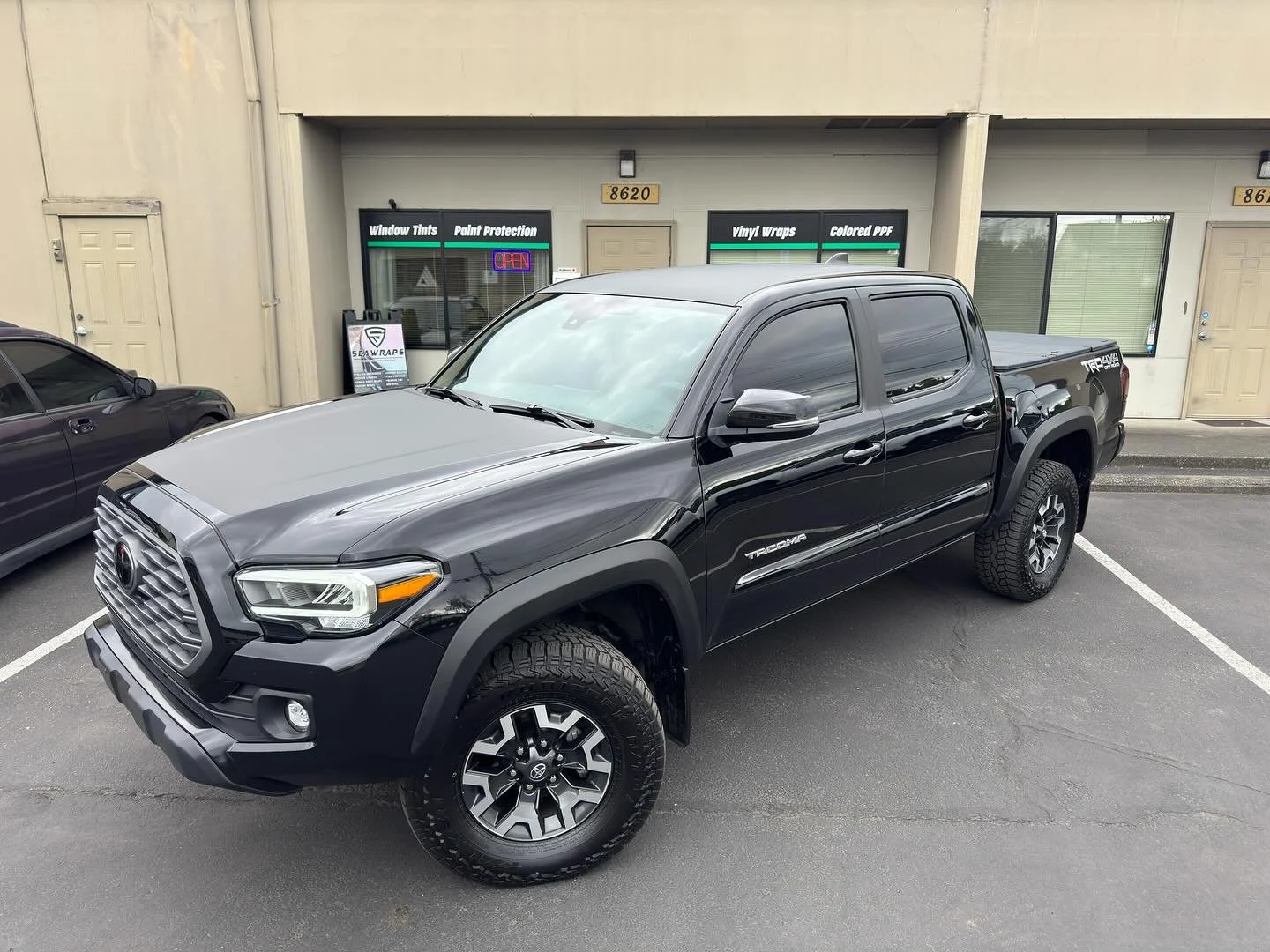Hood and roof wrap on this Tacoma! Went with matte black to accent the hood body lines and full roof, with pillars to bring it all together!