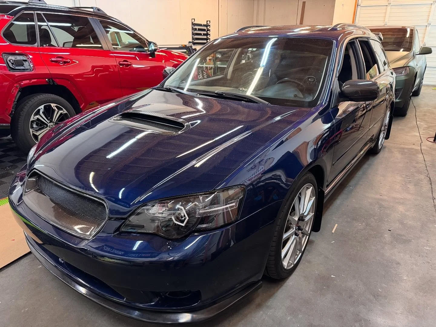 MASSIVE interior wrap on this super baller custom Legacy, probably $150k+ put into this thing. Client really wanted the blue carbon look to match that custom paint job on the exterior. Found the perfect match which tied it in great! Paired that with 