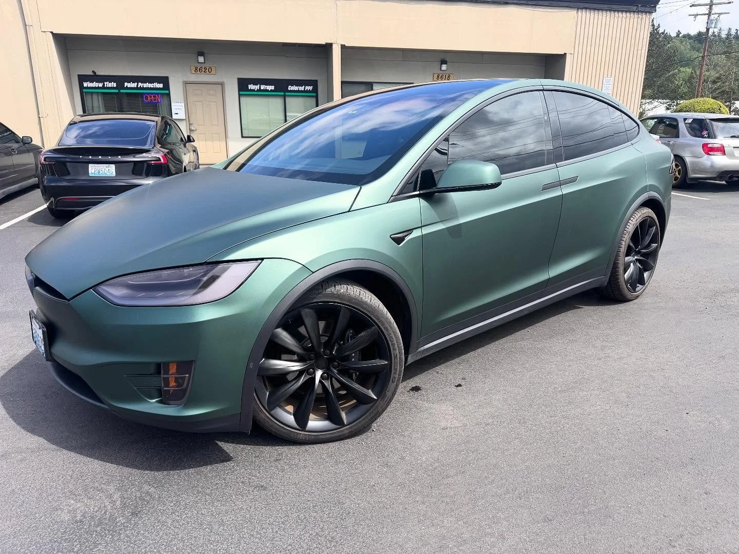 Full wrap on this Tesla Model X! Went with 3M 2080 Matte Pine Green! Looks super sleek on this thing! Paired the job up with a full chrome delete in satin black to give it that modern look as well as tail light tinting and front 2 windows tinted 20% 