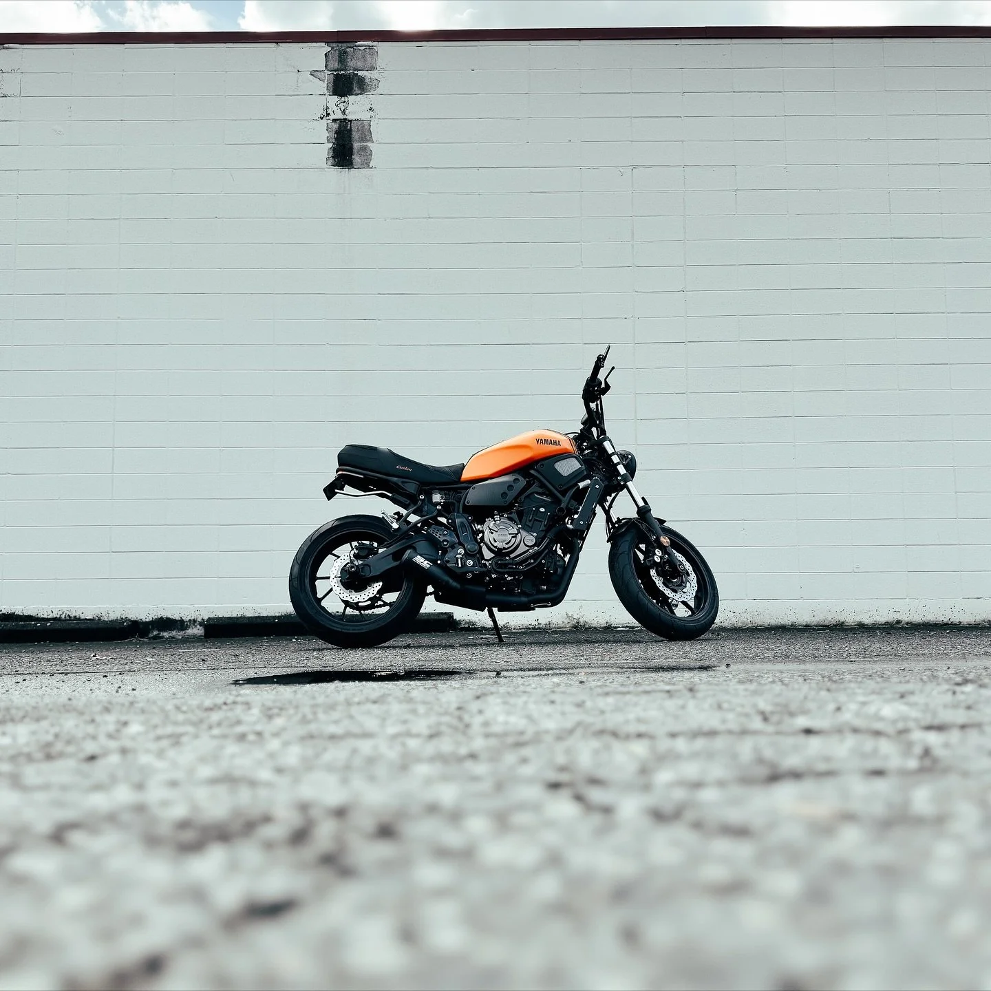 This 2018 Yamaha XSR700 came in for a fresh new look! We wrapped the gas tank in Avery Dennison Matte Orange and added some Satin Black pinstripes down the sides along with Satin Black Yamaha Letters we cut in house. The customer loved how it turned 