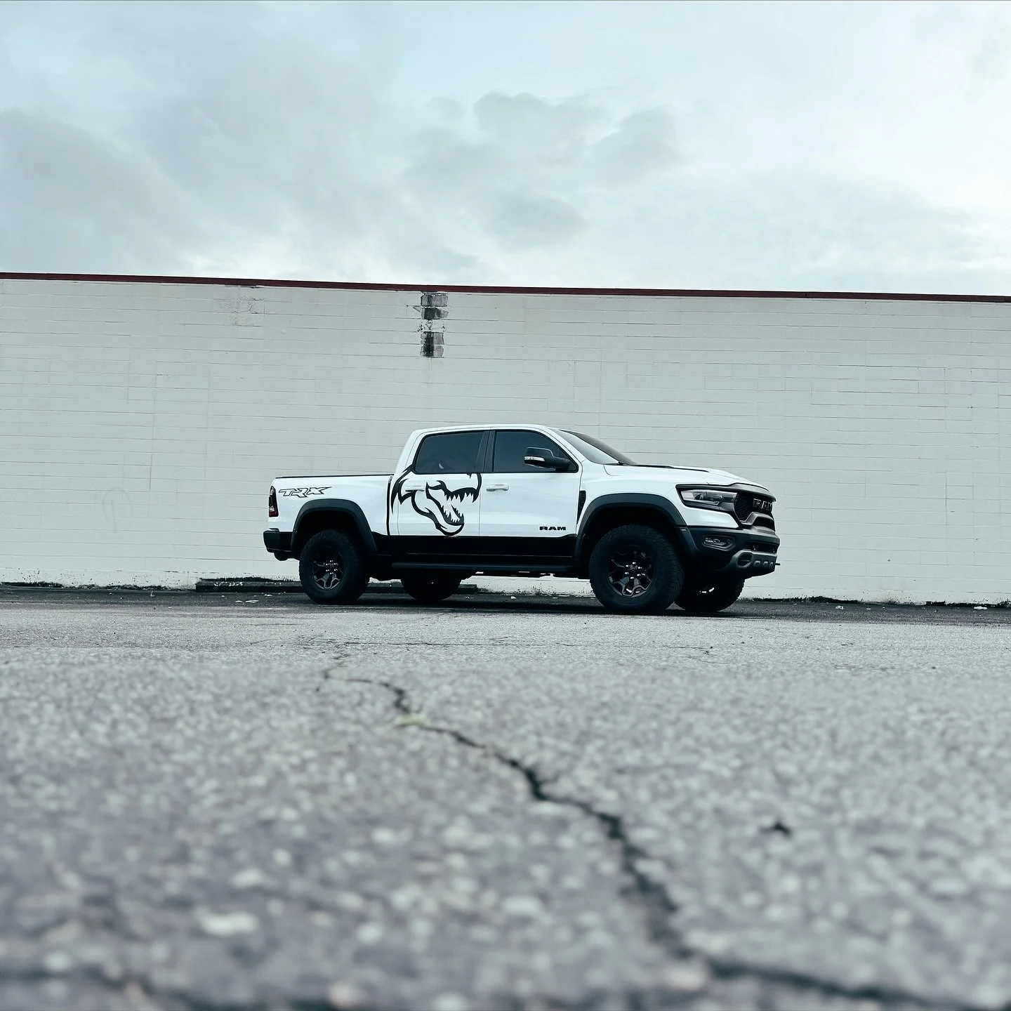 This white Ram TRX received a full custom decal package, using @cheetah.wrap for the TRX decal  and @unityppf on the eye inlay for enhanced depth and durability. Whether you own a Charger, Challenger, or TRX, our shop provides comprehensive, high qua